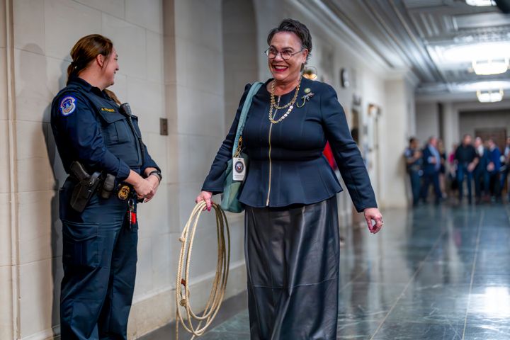 Rep. Harriet Hageman (R-Wyo.) is all smiles heading into a GOP conference meeting, with a lasso rope, as the House remains at a standstill without a speaker.