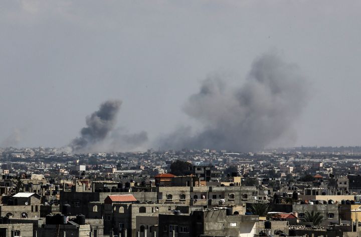 Smoke rises after an Israeli airstrike Friday, the seventh day of clashes, in Rafah, Gaza.