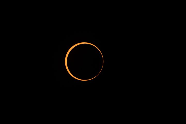 BOERNE, TEXAS - OCTOBER 14: A rare "ring of fire" annular solar eclipse is seen on October 14, 2023 in Boerne, Texas. Differing from a total solar eclipse, the moon in an annular eclipse appears too small to cover the sun completely, leaving a ring of fire effect around the moon. The next annular solar eclipse visible from the United States won't happen until June 21, 2039. (Photo by Rick Kern/Getty Images)